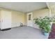 Spacious covered patio area with two entry doors at 2208 Orkney Dr, Leesburg, FL 34788