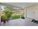 Covered patio looking to backyard at 2208 Orkney Dr, Leesburg, FL 34788