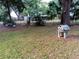 Spacious backyard with mature trees providing shade, room for recreation, and outdoor relaxation at 22736 Sw 117Th St, Dunnellon, FL 34431
