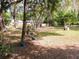 Large backyard, featuring a picnic area with dining and mature trees at 22736 Sw 117Th St, Dunnellon, FL 34431