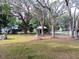 Inviting front yard with mature trees, creating a peaceful and shaded outdoor space at 22736 Sw 117Th St, Dunnellon, FL 34431