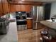 Spacious kitchen with stainless steel appliances, wood cabinets and plenty of marble countertop space at 22736 Sw 117Th St, Dunnellon, FL 34431