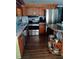 Efficient kitchen with wood cabinets, stainless steel appliances, and functional layout maximizing space and convenience at 22736 Sw 117Th St, Dunnellon, FL 34431