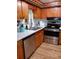 A well-lit kitchen featuring wooden cabinets, modern appliances, and a clean, white countertop space at 22736 Sw 117Th St, Dunnellon, FL 34431