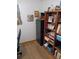Small office area with laminate flooring, built in shelving, a chair and file cabinet at 22736 Sw 117Th St, Dunnellon, FL 34431