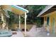 Cozy patio area featuring comfortable seating and decorative plants, ideal for outdoor relaxation and entertaining at 22736 Sw 117Th St, Dunnellon, FL 34431