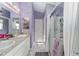 Bathroom features double sinks, shower, and ample storage space at 2296 Sheehan St, The Villages, FL 32163