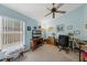 Bedroom with ceiling fan, large window, desk and chair at 2434 Walnut Heights Rd, Apopka, FL 32703