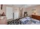 Bedroom with cozy quilt, dresser, and abundant natural light at 2434 Walnut Heights Rd, Apopka, FL 32703