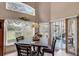 Bright dining area featuring a view of the backyard and access to the screened lanai at 2434 Walnut Heights Rd, Apopka, FL 32703
