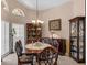 Formal dining room with decorative chandelier and display cabinet at 2434 Walnut Heights Rd, Apopka, FL 32703