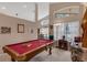 Spacious game room with pool table and high ceilings at 2434 Walnut Heights Rd, Apopka, FL 32703