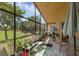 Screened-in patio with view of landscaping at 2434 Walnut Heights Rd, Apopka, FL 32703