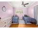 Bedroom with twin beds, hardwood floors, and a light pink color scheme at 2475 Sw 7Th Ave, Ocala, FL 34471