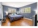 Spacious bedroom showcasing hardwood floors and lots of natural light at 2475 Sw 7Th Ave, Ocala, FL 34471