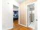 Hallway leading to a blue bedroom and an updated bathroom at 2475 Sw 7Th Ave, Ocala, FL 34471