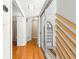 Hallway with wood floors and natural light, leading to other rooms at 2475 Sw 7Th Ave, Ocala, FL 34471