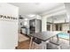 Breakfast nook off the kitchen with a stainless steel fridge and pool view at 2475 Sw 7Th Ave, Ocala, FL 34471