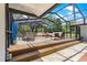 Spacious screened-in pool deck with comfortable seating and dining areas for outdoor gatherings at 2475 Sw 7Th Ave, Ocala, FL 34471