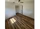 Bedroom with laminate flooring, ceiling fan, and closet at 3740 Ne 5Th St, Ocala, FL 34470