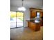 Open eat-in kitchen with breakfast bar and stainless appliances and a pool view at 3740 Ne 5Th St, Ocala, FL 34470