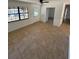 Open living room with tile floors, bright windows, and a ceiling fan at 3740 Ne 5Th St, Ocala, FL 34470
