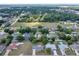 Scenic aerial view of homes nestled in a vibrant, tree-filled neighborhood, showcasing community living at 4331 Se 106Th Pl, Belleview, FL 34420