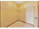Empty walk-in closet offering ample storage space for clothing and accessories at 4331 Se 106Th Pl, Belleview, FL 34420