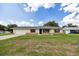 Charming single-story home featuring stone accents, a well-maintained lawn, and an attached one-car garage at 4331 Se 106Th Pl, Belleview, FL 34420