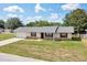 Charming single-story home featuring stone accents, a well-maintained lawn, and an attached one-car garage at 4331 Se 106Th Pl, Belleview, FL 34420