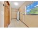 Laundry room featuring a utility sink and a window at 4331 Se 106Th Pl, Belleview, FL 34420