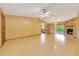 Open-concept living room boasts wood floors, fireplace, and natural light at 4331 Se 106Th Pl, Belleview, FL 34420