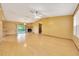 Spacious living room featuring laminate flooring, and a stone fireplace, perfect for entertaining at 4331 Se 106Th Pl, Belleview, FL 34420