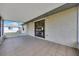 Large screened patio with tile flooring, perfect for outdoor entertaining at 4331 Se 106Th Pl, Belleview, FL 34420