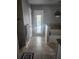 Bathroom with neutral tile floors, walk-in shower, and direct access to pool at 4520 Se 28Th St, Ocala, FL 34480