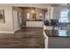 Open kitchen with granite counters, modern lighting, and seamless flow to adjacent rooms at 4520 Se 28Th St, Ocala, FL 34480