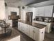 Bright kitchen with white cabinets, stainless steel appliances, and central island at 4520 Se 28Th St, Ocala, FL 34480