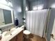 Bathroom with tiled floor, single sink vanity, and shower with tub at 4990 Sw 63Rd Loop, Ocala, FL 34474