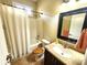 Bathroom features a shower and tub combination and a single sink vanity at 4990 Sw 63Rd Loop, Ocala, FL 34474