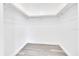 A walk-in closet with ample storage space and light grey laminate flooring at 6 Bahia Circle Loop, Ocala, FL 34472