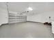 Spacious two car garage featuring clean white walls and a light gray epoxy floor at 6 Bahia Circle Loop, Ocala, FL 34472