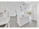 Open-concept kitchen and living room with eat-in island and modern hanging lights at 6 Bahia Circle Loop, Ocala, FL 34472