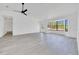 Bright living room features new light-grey flooring, and a large bay window at 6 Bahia Circle Loop, Ocala, FL 34472