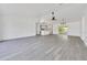 Spacious living room with light-grey flooring open to kitchen and featuring modern lighting at 6 Bahia Circle Loop, Ocala, FL 34472