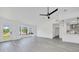 Bright living room features new light-grey flooring, front door, and bay window at 6 Bahia Circle Loop, Ocala, FL 34472