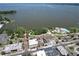 Aerial view showcasing the town, the lake and the community's waterfront park and pool at 705 Washington Ave, Eustis, FL 32726