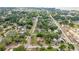 Aerial view of a home with a lovely neighborhood setting, surrounded by mature trees and friendly streets at 705 Washington Ave, Eustis, FL 32726