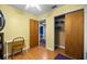 Bedroom featuring hardwood floors, a closet and a view to another bedroom at 705 Washington Ave, Eustis, FL 32726