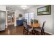 Eat-in dining area features a wooden table with seating for four and natural light from a window at 705 Washington Ave, Eustis, FL 32726