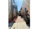 Outdoor alleyway with artwork and fire escape at 705 Washington Ave, Eustis, FL 32726
